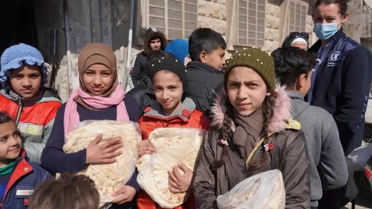 مقابلة مع رئيس أساقفة حمص بشأن تعليق برنامج الأغذية العالمي مساعداته لسورية (photo: WFP/Hussam Al Saleh)